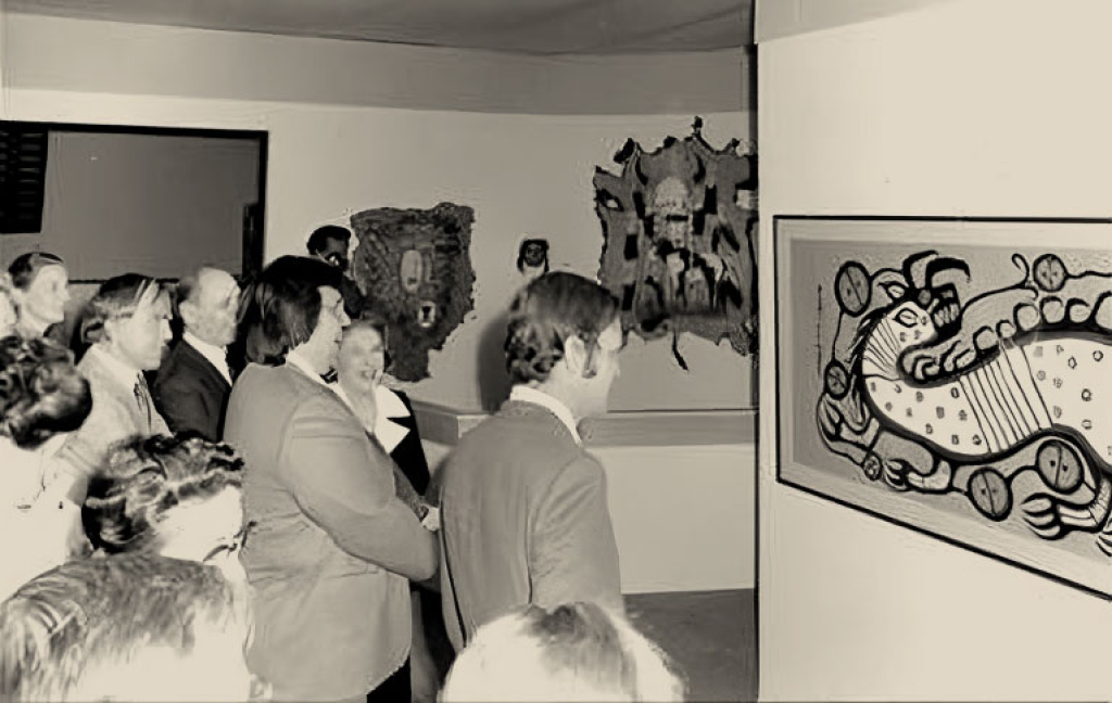Photograph of Jean Chrétien viewing Water Spirit by Morrisseau in an exhibition